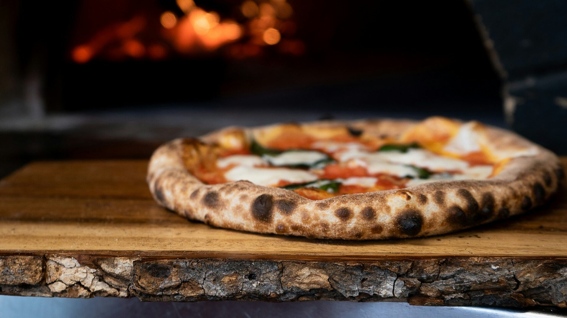 The best pizza in Rome on a wooden cutting board